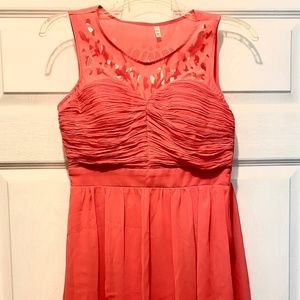 Coral dress with cutout details